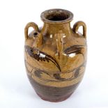 A 19th Century South European earthenware urn, with four lug handles and spout,