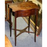 A Regency mahogany worktable with serpentine border and platform base,