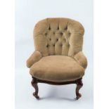 A Victorian deep buttoned back chair on moulded cabriole legs