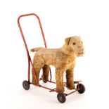 A toy push-a-long mohair dog,