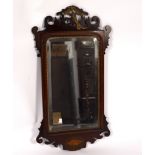 A mahogany wall mirror, the frame with gilded hoho bird and oval shell patera,