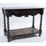 A Victorian ebonised side table, circa 1860, the moulded oblong top above a palmette incised frieze,