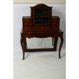 A mid 19th Century mahogany gilt metal moulded bonheur du jour with superstructure of drawers and