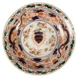 A large early 18th Century Imari dish, Edo period, the interior decorated in green,