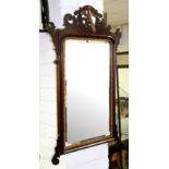 A George II style mahogany fret framed mirror, inlaid a shell and a gilt phoenix crest,