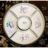 A Poole pottery hors d'oeuvres dish of five pieces, painted fish on a turned wood tray,