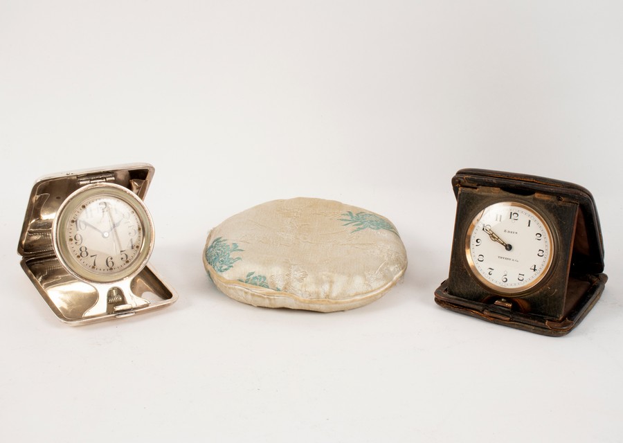 A silver cased bedside clock by Elgin, the circular dial with Arabic numerals, the case 8.