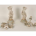 A pair of Minton Night and Day parcel-biscuit turquoise edged porcelain candelabra with fixed bases,