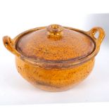 A 19th Century German casserole with lid, orange speckled glaze,