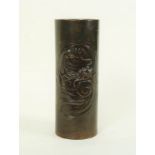 A Japanese Meiji period cylindrical bronze vase decorated a dragon in swirling clouds,