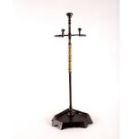A burnished steel stick stand,
