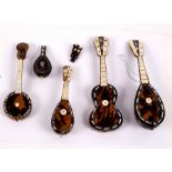 A small group of tortoiseshell and bone instruments, including lute,