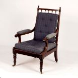 A George IV mahogany library chair with spindle turned uprights and scroll arms,