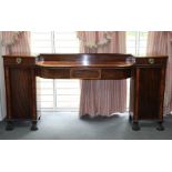 A Regency mahogany pedestal sideboard, crossbanded in burr walnut,