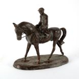 A mid 20th Century bronze figure of a horse and jockey on an oval base,