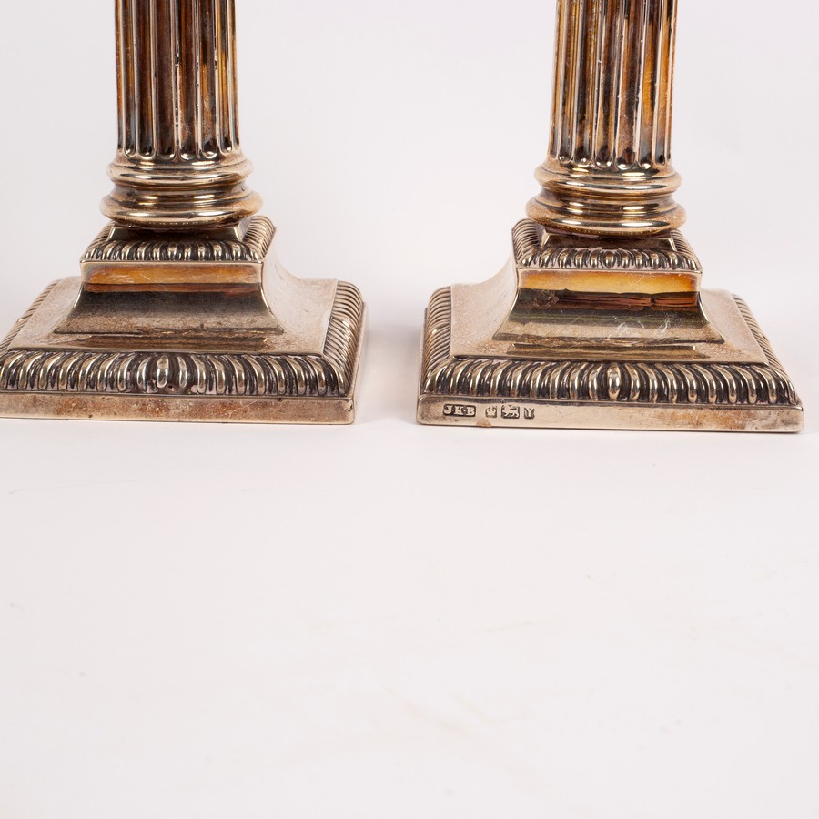 A pair of silver dwarf candlesticks of Corinthian column form, Hawksworth, Eyre & Co. Ltd. - Image 2 of 2