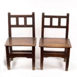 A pair of 17th Century Spanish walnut chairs with solid seats on square legs and stretchers