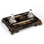 A Victorian partners' papier-mâché inkstand, fitted a pen tray to each side,