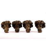 Four bronze lantern supports in the form of Nubian busts,