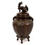 A Japanese bronze koro with dragon finial,