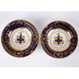 A pair of Chamberlain's Worcester armorial blue ground soup plates, circa 1820, printed red marks,