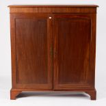 A mahogany cupboard enclosed by a pair of panel doors,