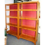 A pair of painted and gilded display cases,