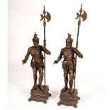 A pair of fire ornaments modelled as Renaissance style Knights in armour,