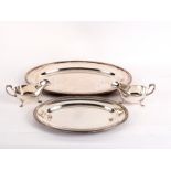 Two Christofle plated meat plates with beaded borders and a pair of sauce boats