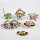 A group of flower encrusted English porcelain,