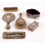 A group of silver dressing table items, various dates and makers, including silver backed mirror,