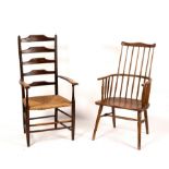 A comb back chair, with shaped seat and turned legs,