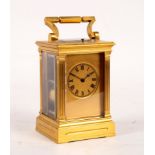 A gilt brass hour-repeat carriage clock with fluted columns to the sides,