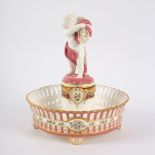 A Minton pierced footed figural comport, circa 1860, printed pink marks,