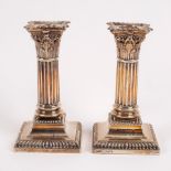 A pair of silver dwarf candlesticks of Corinthian column form, Hawksworth, Eyre & Co. Ltd.