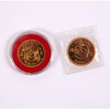 A Hong Kong $1000 gold coin for the Year of the Dragon, 1976 and another for the year of the Snake,