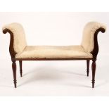 An upholstered window seat with scroll ends and turned legs,