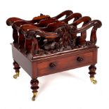 A Regency rosewood music Canterbury with pierced divisions and spindle turned supports,