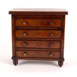 A 19th Century mahogany apprentice chest of four long drawers, 23.