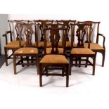 A matched set of George II style mahogany dining chairs with pierced upright splat backs,