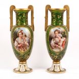 A pair of green and gold Bohemian glass two-handled vases,