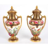 A pair of Copeland two-handled vases and covers, painted luxuriant flowers by T Sadler,