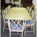 A green and cream painted dining room suite, comprising extending twin-pillar dining table,