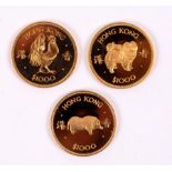 A Hong Kong $1000 gold coin for the Year of the Rooster, 1981, another for the Year of the Dog,