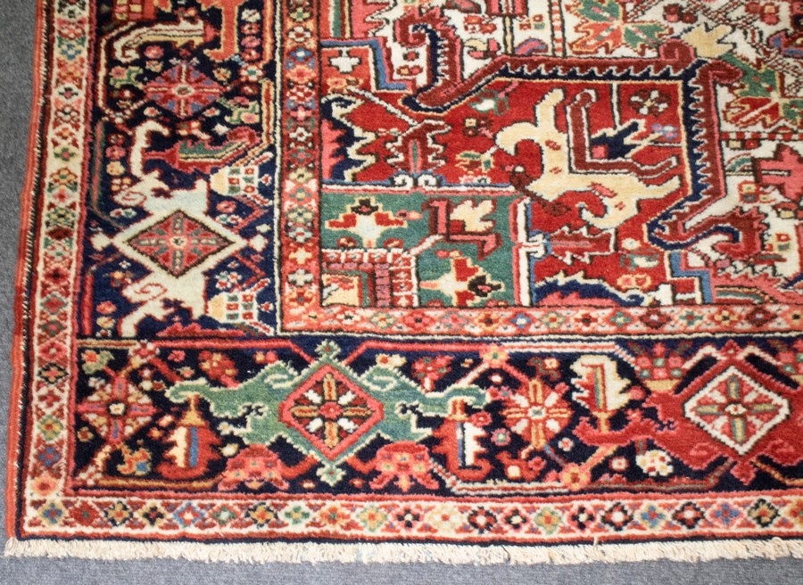 A Persian Heriz carpet, early 20th Century, of geometric design within a multiple border, - Image 2 of 3