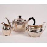 A matched George III three-piece silver tea set, the teapot and jug AF, London 1799/1802,