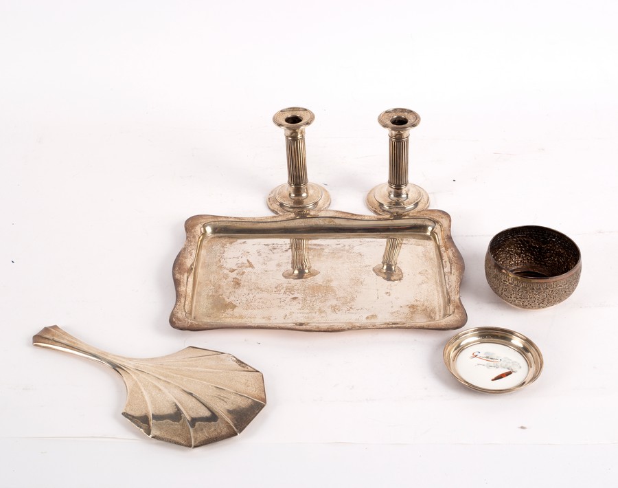 A pair of silver candlesticks, Birmingham 1930, a silver rectangular tray, Chester 1909,