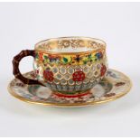 A Chamberlains Worcester reticulated double-walled teacup and saucer in the Chinese style/see