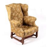 A George III style wingback armchair