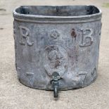 An 18th Century half-round lead cistern, initialled RB and dated 1772,